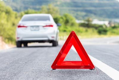 A car receiving roadside assistance from Ace Mobile Marine and Automotive, ensuring prompt help for flat tires, breakdowns, and other mechanical issues